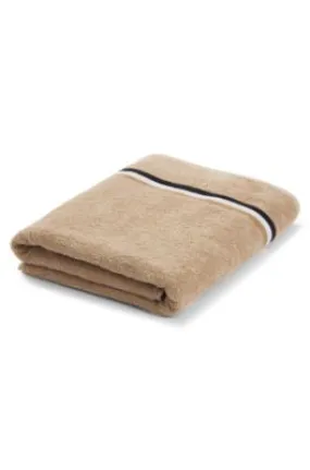 Cotton-terry bath sheet with signature-stripe ribbon