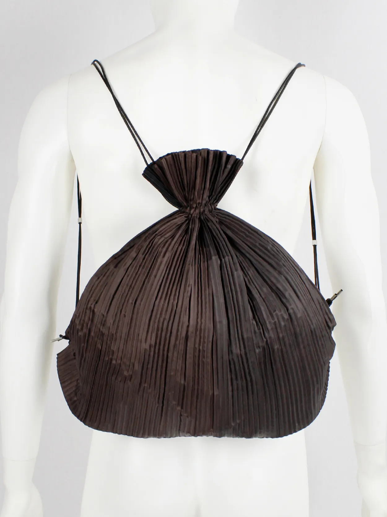 Issey Miyake dark brown drawstring backpack with fine pressed pleats