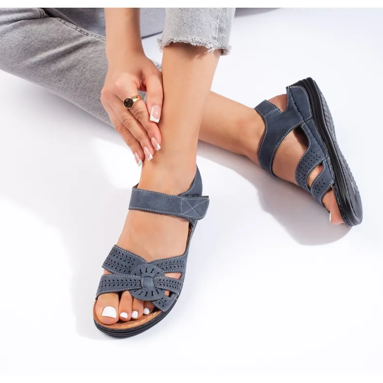 Light blue women's sandals with a low wedge