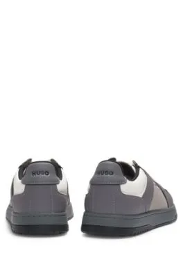 Mixed-material trainers with nubuck-effect trims