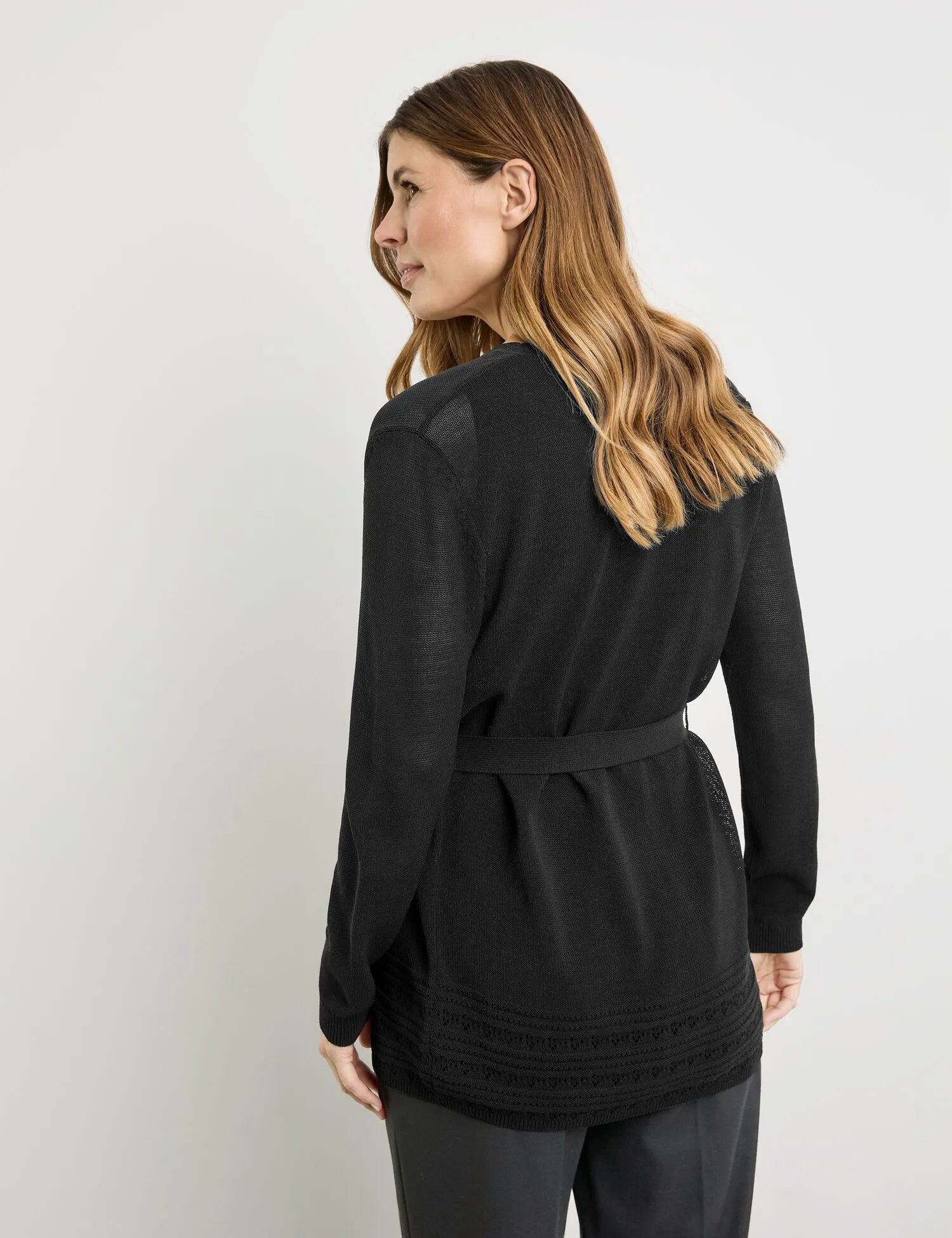 Open cardigan with crocheted details and a tie-around belt